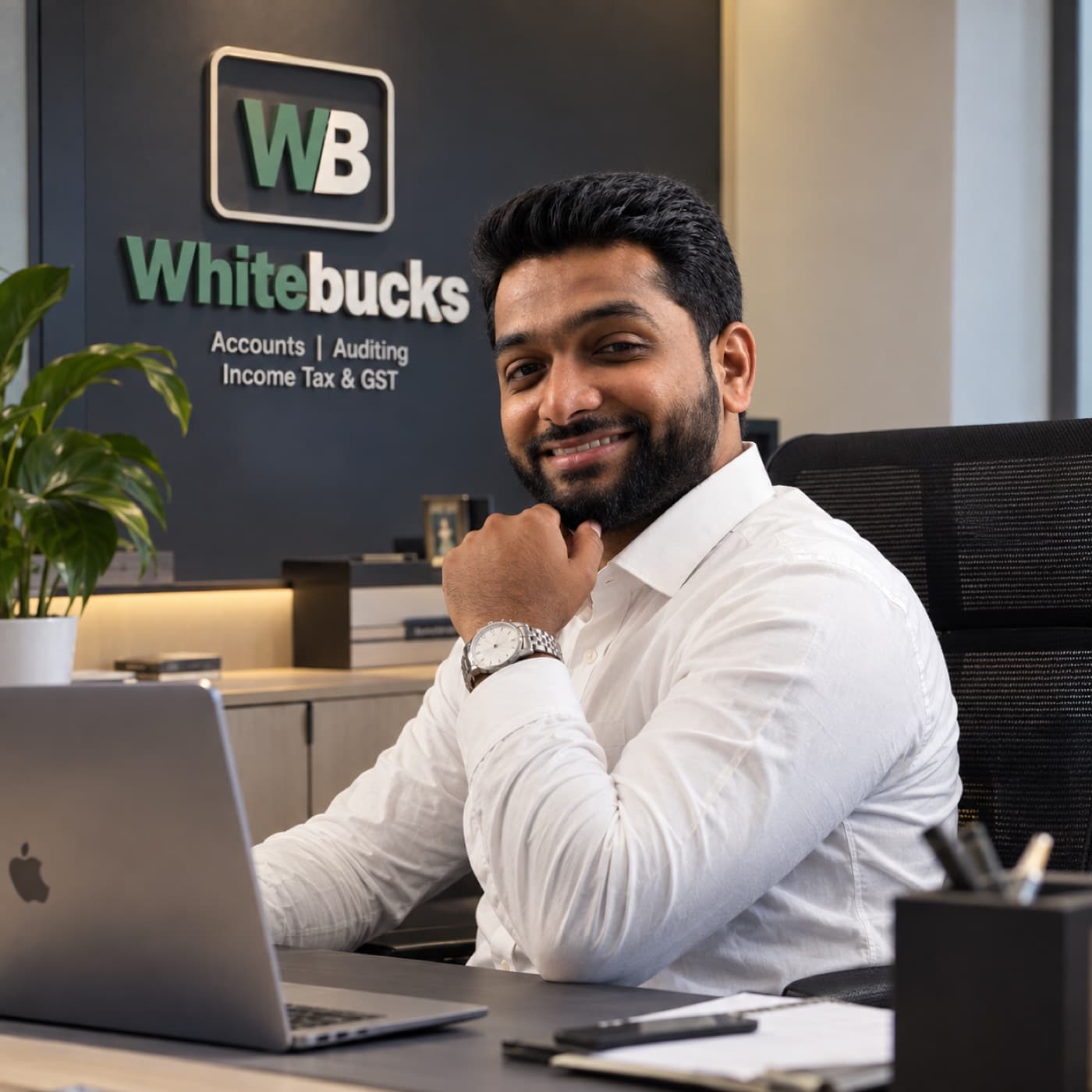 Ismail T Aboobacker, Founder and CEO of Whitebucks Consultants, seated at his office desk